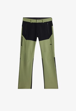 Zielono-czarne spodnie outdoorowe wykonane z tkaniny technicznej. Posiadają wiele zapinanych na zamek kieszeni oraz wyraźny design w blokach kolorów.