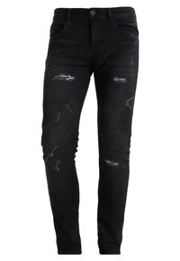 Czarne jeansy z denimu o dopasowanym kroju, z przetarciami i rozdarciami na przodzie. Klasyczny design z pięcioma kieszeniami i zapięciem na zamek.