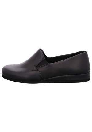 Black leather slip-on shoe with a smooth finish, rounded toe, minimal stitching details, and a low, flat rubber sole.