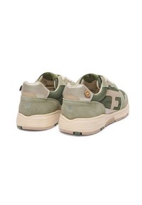 Green and beige sneakers with suede and fabric upper, round toe, laces, padded collar, and back logo detail. Thick, textured sole with green accents.