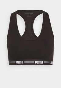 Zwarte sportbeha met een ronde halslijn, racerback-ontwerp, elastische band met het witte Puma-logo en strepen aan de onderkant.