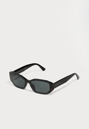 Black sunglasses with an angular shape, adorned with a rhinestone accent along the frame, featuring dark lenses and solid arms.