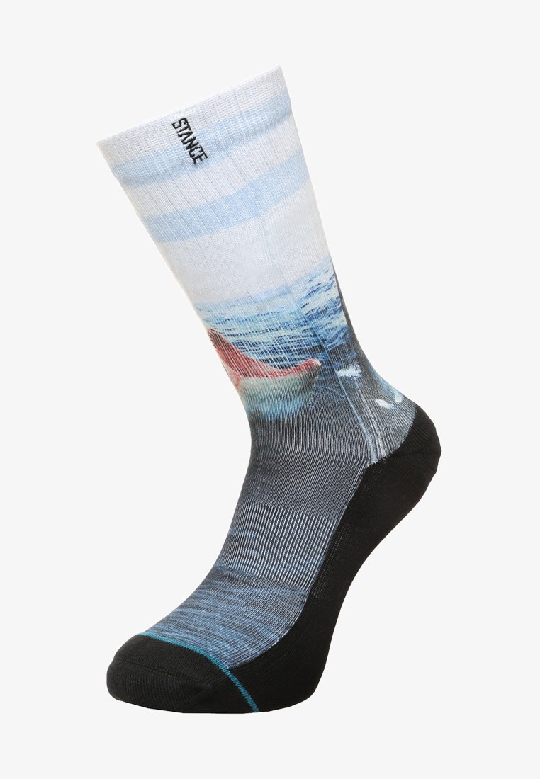 Crew sock with a blue and white wave pattern, black lower section, and a red boat motif. Made from textured synthetic material.