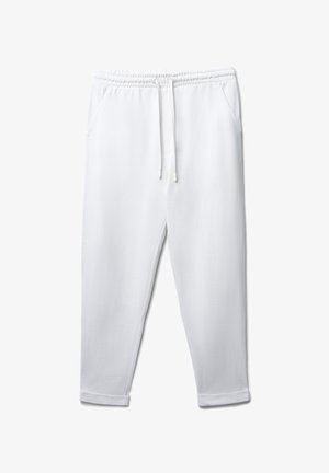 Weiße Baumwoll-Jogginghosen mit elastischem Bund, Kordelzug, seitlichen Taschen und Bündchen an den Knöcheln. Glatte Textur und entspannte Passform.
