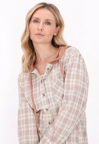 Lange mouwen geruit shirt in beige en lichtbruin met een capuchon, voorzien van een knoopsluiting aan de voorkant, een borstzak en een gestructureerde stof.