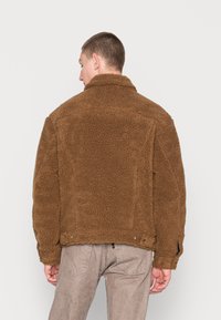 Levi's® TRUCKER UNISEX - Fleece jacket - sepia