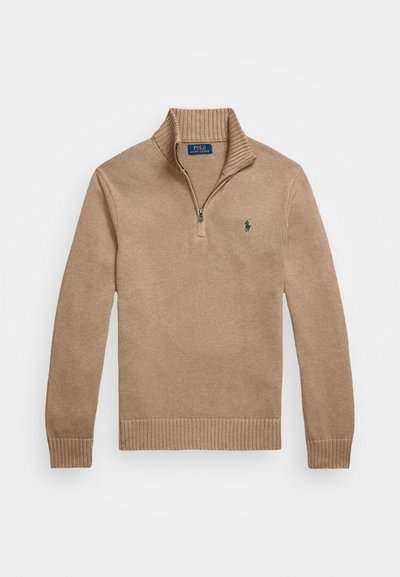 Beige knit sweater featuring a half-zip collar, ribbed cuffs and hem, with a small green logo on the left chest. Made from textured fabric.