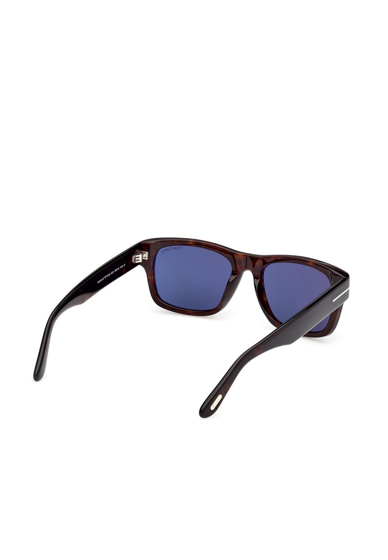 Tortoiseshell sunglasses with dark blue lenses. Square frame design, smooth finish, and a metal accent on the temples.
