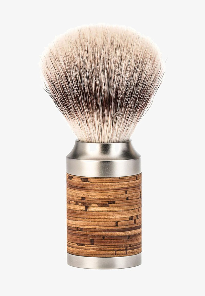 Shaving brush with dense, soft bristles and a cylindrical wooden handle featuring horizontal grain patterns and metal accents.