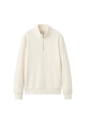Kremowa bluza typu pulower wykonana z miękkiego materiału, z wysokim kołnierzem i krótkim zamkiem błyskawicznym oraz ściągaczami na mankietach i dole.