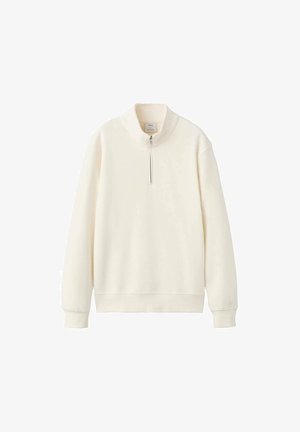 Vaaleanvärinen collegepaita, valmistettu pehmeästä kankaasta, jossa on korkea kaulus lyhyellä vetoketjulla sekä resorit hihansuuissa ja helmassa.