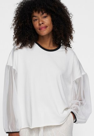 Witte sweatshirt met doorschijnende, puffy mouwen, een zwarte geribbelde halslijn en een relaxte pasvorm. Bevat een klein logo-detail aan de voorkant.