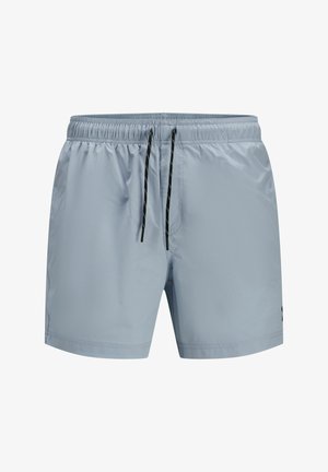 Svetlomodré plavky vyrobené z hladkej syntetickej tkaniny; majú elastický pás s čiernymi šnúrkami a bočné vrecká.