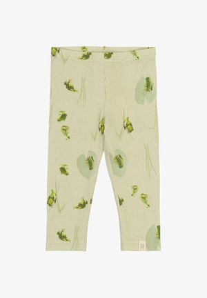 Zelené legíny so vzorom žaby a lekná na svetlozelenom pozadí, vyrobené z mäkkej, elastickej tkaniny s pohodlným pásom.