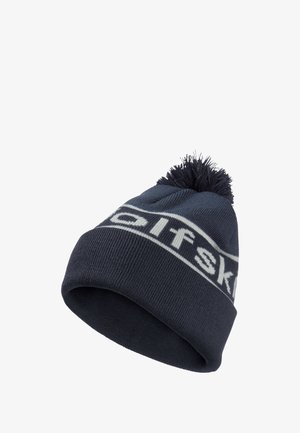 Navy knit beanie with a white logo band, topped with a fluffy pom-pom. Features a textured finish and snug fit for warmth.