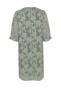 Grön tygklänning med puffärmar, med ett präglat blommönster och en avslappnad passform, som slutar strax ovanför knäet.