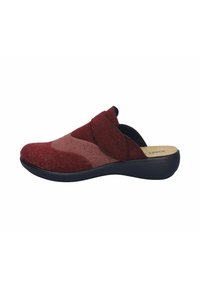 Red and pink felt slip-on shoe with a black sole, featuring a soft texture and an asymmetrical design, highlighting overlapping fabric panels.