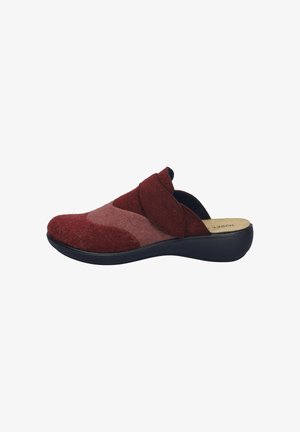 Red and pink felt slip-on shoe with a black sole, featuring a soft texture and an asymmetrical design, highlighting overlapping fabric panels.