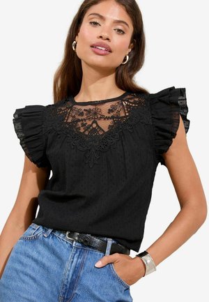Blusa nera con maniche corte a volant, scollatura in pizzo con motivi floreali, tessuto testurizzato e una vestibilità comoda con scollatura tondeggiante.