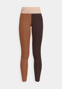 Leggings featuring a color-block design with dark brown and light brown sections. Made from ribbed fabric, with a soft, wide waistband.