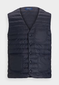 Granatowa zapinana na guziki pikowana kamizelka z dekoltem w serek, z dwoma przednimi kieszeniami i poziomym przeszyciem. Wykonana z lekkiego materiału.