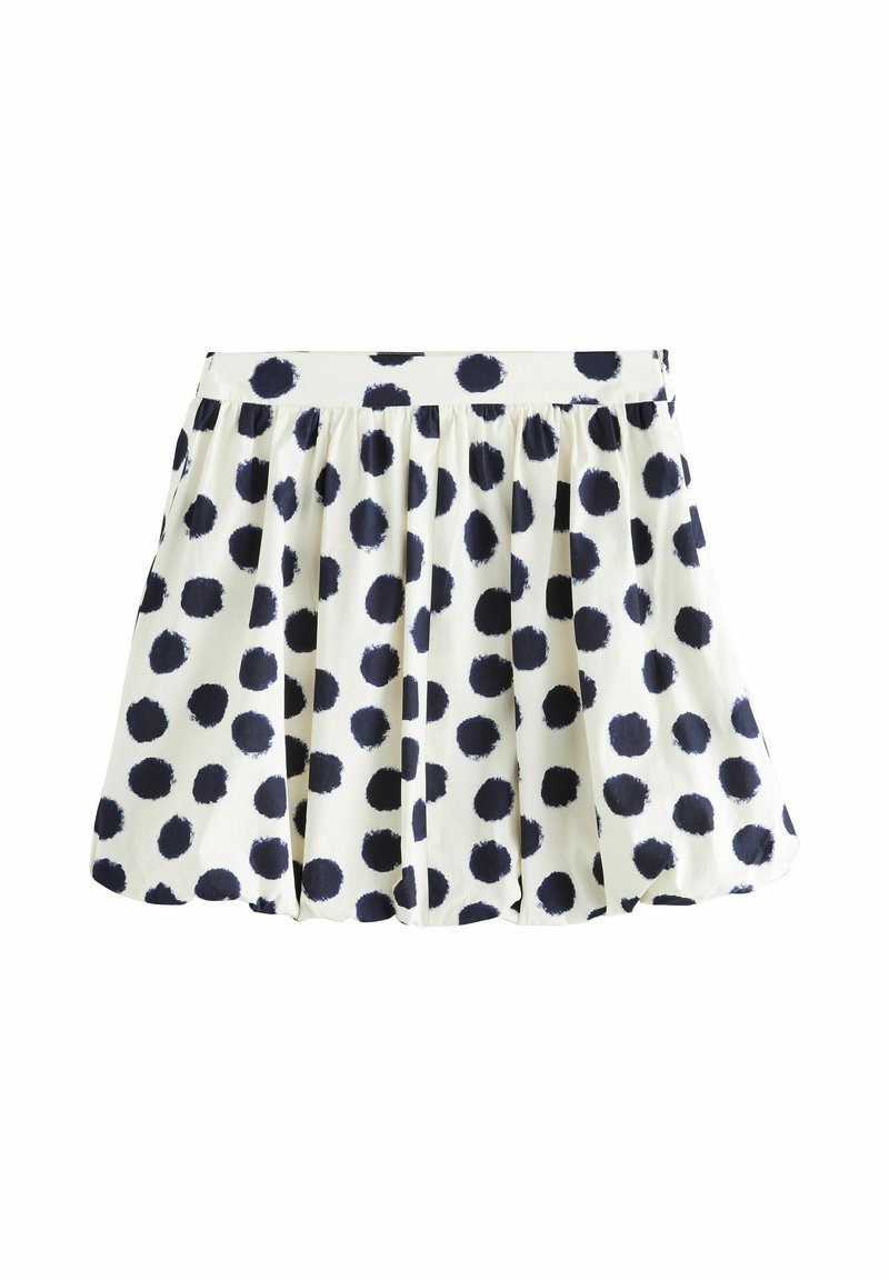 Weißer Rock mit großen dunkelblauen Polka Dots, plissiertes Design und elastischem Bund. Hergestellt aus einem leichten Stoff mit glatter Textur.