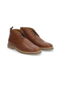 Bottes de cheville en cuir marron avec une finition lisse, bout arrondi et design à lacets. Présente une semelle texturée et un petit talon.