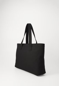 Black tote bag made of durable fabric, featuring two sturdy handles, simple rectangular shape, and smooth texture. No visible patterns or accents.