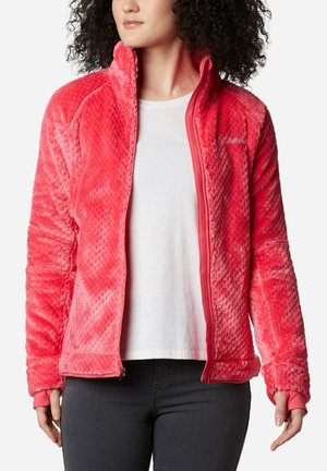 Giacca in pile di un luminoso rosa, con un motivo testurizzato, zip frontale completa e polsini a coste. Fodera interna liscia senza loghi visibili.