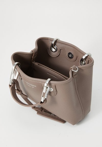 Brown textured leather handbag with silver hardware, featuring two short handles and a zippered inner pocket. Open-top design.