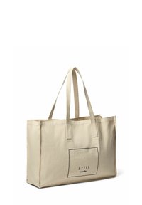 Beige Canvas-Shopper mit zwei Griffen, rechteckiger Form und bedrucktem Text "still nordic" in einem schwarzen Feld auf einer Seite.