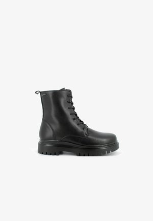 Stivale alla caviglia nero con lacci realizzato in pelle liscia, presenta una suola spessa con trazione, punta tondeggiante e una linguetta sul retro.