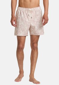 Herrsimbyxor i ljusrosa tyg med ett repetitivt vitt abstrakt mönster. Elastisk midja med dragsnöre, mid-thigh längd.