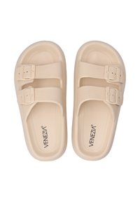 Beige sandals with two wide, textured straps featuring adjustable buckles. Made from lightweight material, with a patterned footbed for grip.