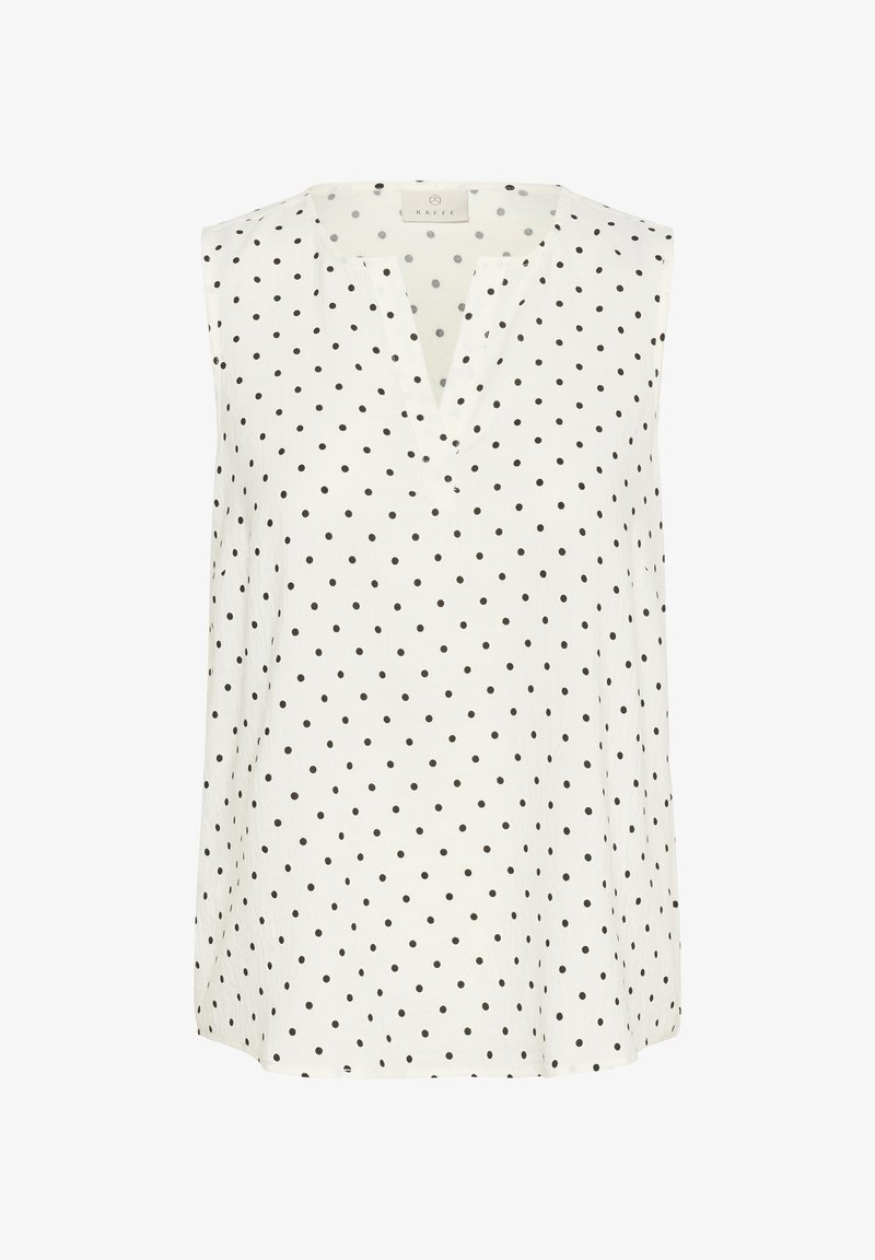 Haut sans manches blanc avec des pois noirs, présentant un décolleté en V et un tissu doux et léger. Design simple adapté à une tenue décontractée.