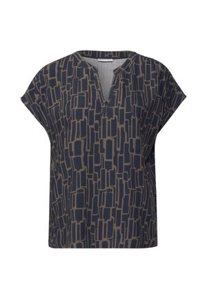 Navy blue blouse with a V-neck and short sleeves, featuring a geometric beige pattern throughout the fabric. Soft texture, relaxed fit.