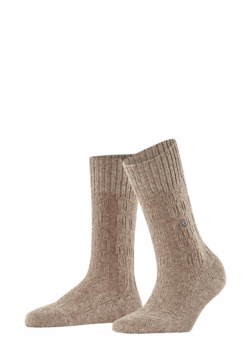 Beżowe skarpetki w wzorki z prążkowanym mankietem, długości do połowy łydki, o gładkiej teksturze, z małym logo po boku.