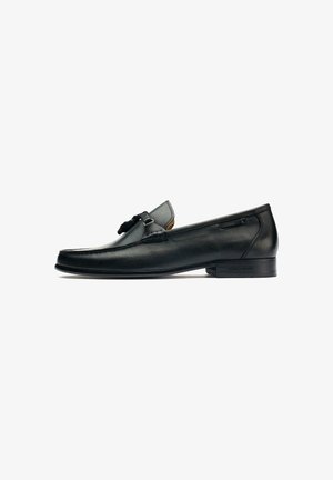 Black leather loafers with a smooth finish, rounded toe, decorative hardware accent, low profile, and subtle stitching details.
