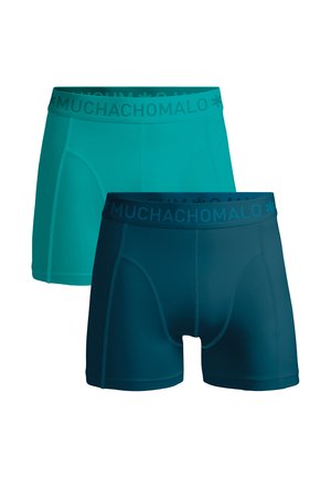 Herenboxerslips in turquoise en donker turquoise. Zachte, rekbare stof met elastische taillebanden met de tekst "MUCHACHOMOLO", een aansluitend ontwerp en zonder patronen.