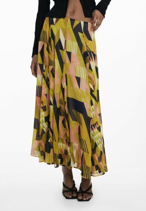 Maxi skirt in lightweight fabric with a geometric pattern in yellow, pink, black, and white. Flared silhouette with an asymmetrical hem.