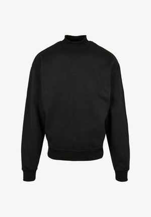 Sort sweatshirt med høj hals, lange ærmer og en kortet kant. Fremstillet af et glat, elastisk stof med ribkant på ærmerne og kraven.