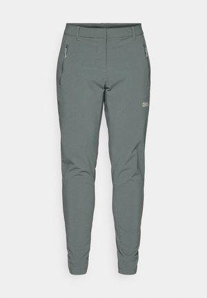 Gray outdoor pants made of lightweight, durable material. Features zippered side pockets and a slim fit design with tapered legs.