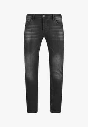 Mustadest denimist püksid, mis on kitsas lõikega, peene tuhmumisega, viie taskuga, nuppude sulgemise ja vöödega. Sile tekstuur.