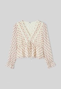 Blouse blanche à motif floral rose, bordure en dentelle, col en V, design à nouer à l'avant, et manches longues avec poignets à volants. Texture de tissu léger.