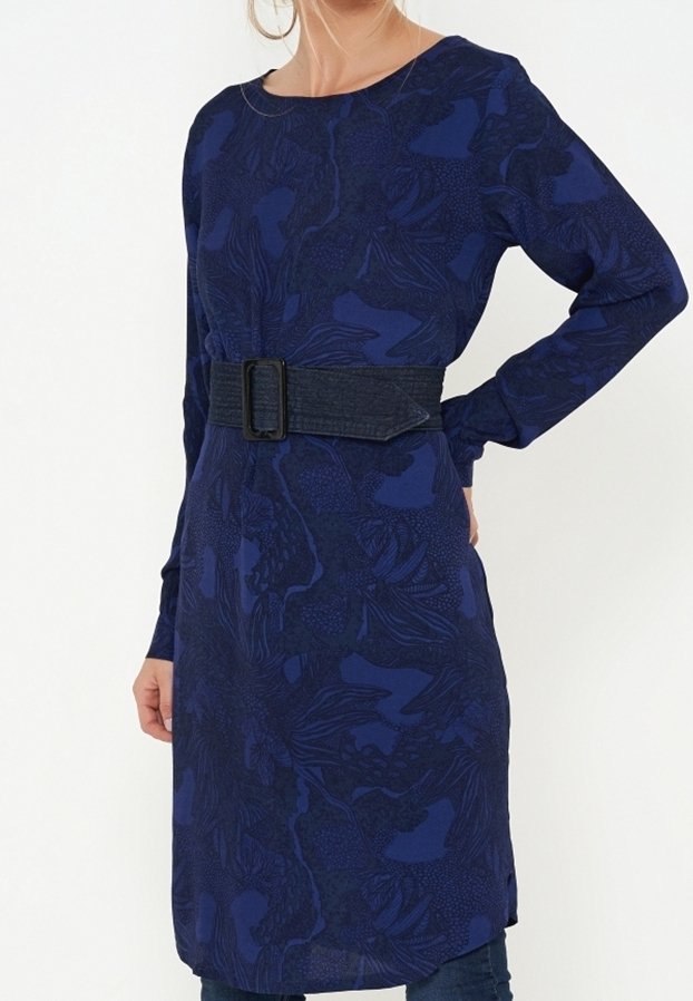 Long-sleeve navy dress with a floral pattern, featuring a denim belt at the waist and side slits for ease of movement.