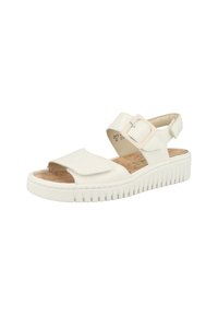 White sandal with cork insole, adjustable strap, wide front panel, and textured rubber sole. Features minimalistic design and hardware accents.