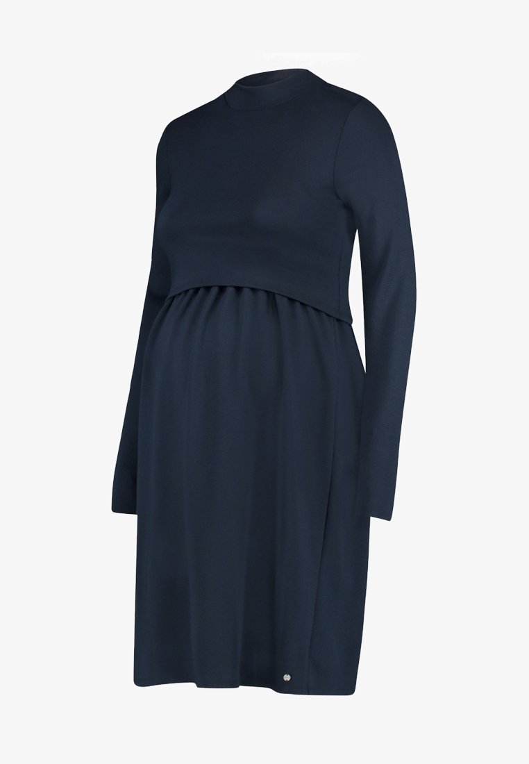 Robe de maternité bleu marine avec des manches longues, un col rond et une taille froncée. Tissu lisse et extensible ; petit logo sur l'ourlet.