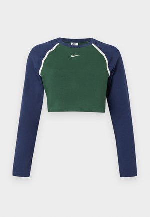 Mikrokort virallinen pitkähiha, jossa on tummanvihreä etuosa, tummansiniset hihat, valkoinen kanttaus ja valkoinen Nike-swoosh-logo rinnassa.