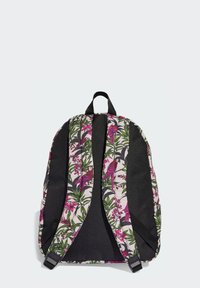 Zaino con stampa floreale e dettagli neri, caratterizzato da vivaci motivi rosa e verdi di uccelli e piante, spallacci imbottiti e maniglia superiore.