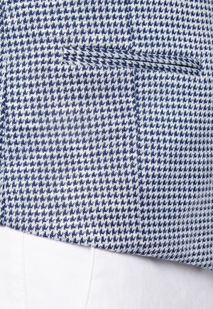 Niebiesko-białe tkanina w wzór houndstooth o gładkiej fakturze, z boczną kieszenią i dopasowanym krojem.